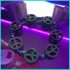 Handmade green wooden peace sign bracelet